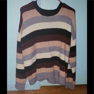 A blu,white, and pink sweater